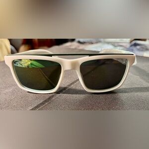 Lacoste L899S eyeglass frame features a trendy rectangle shape